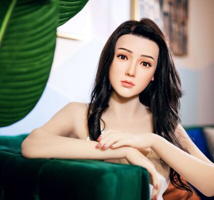 Silicone sex doll with hands on the sofa